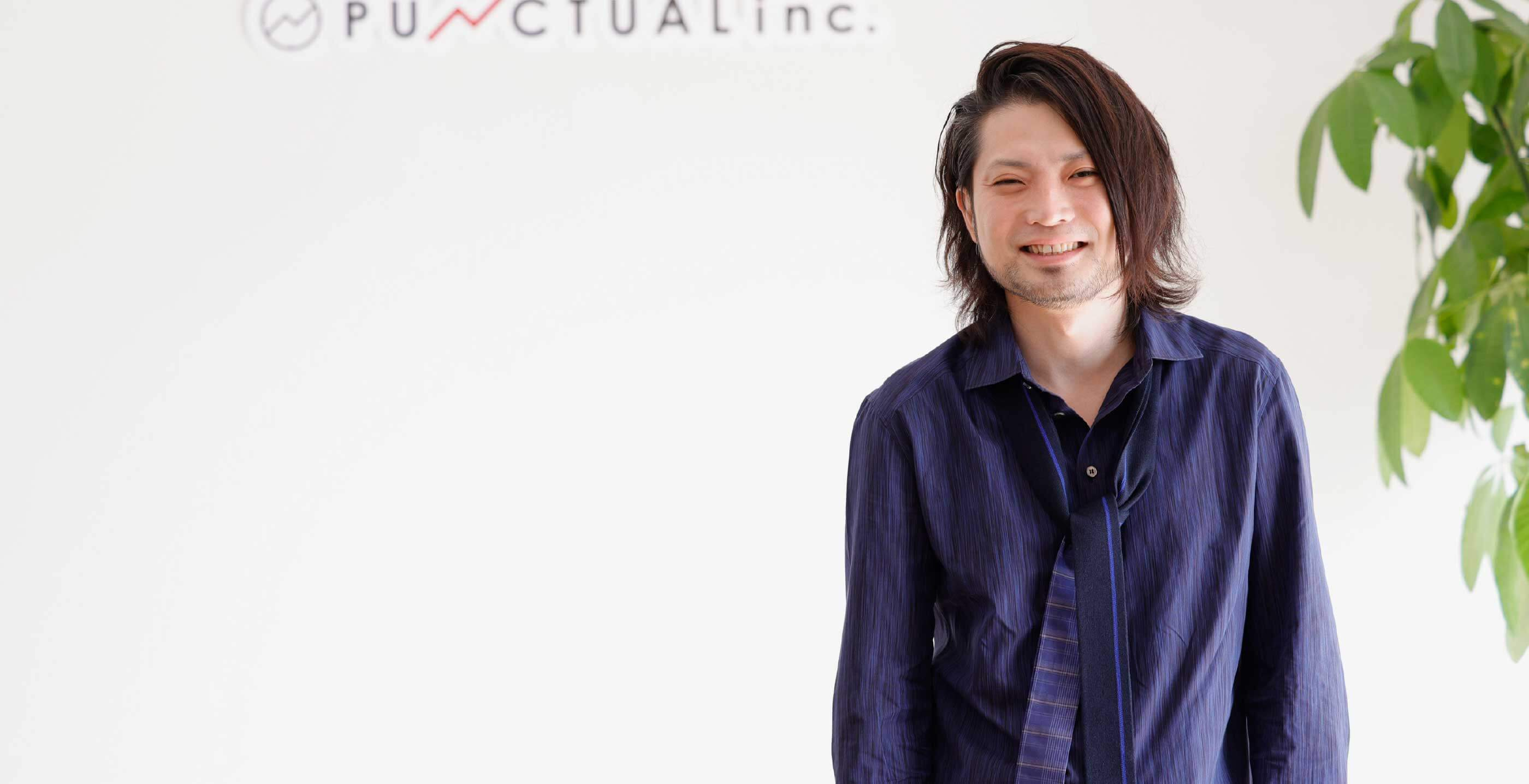 代表取締役の守時 健が笑っている写真